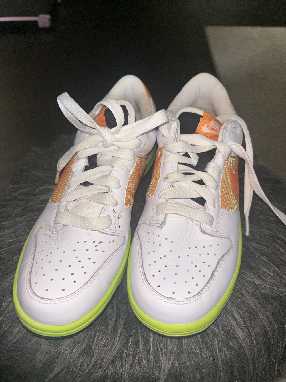 Nike White Sneakers with Orange Accents and Neon Green Trim
